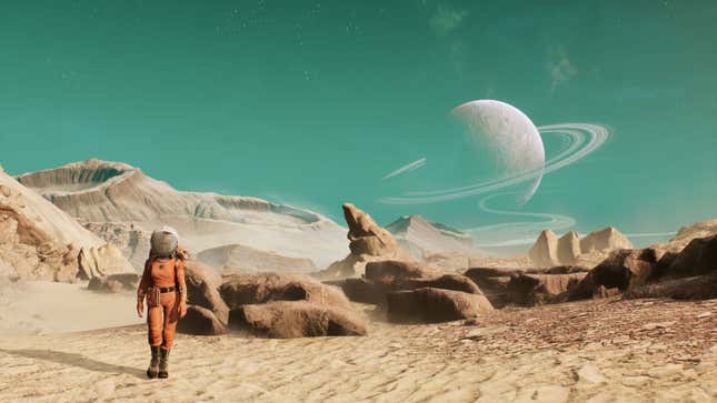 An astronaut stands in an orange suit on rocky sand, before a turquoise sky with a ringed planet.
